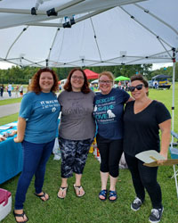 National Night Out volunteers enjoying a great evening engaging with the community!